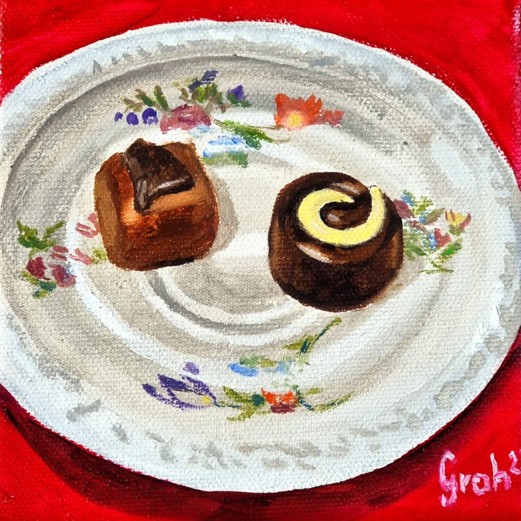 Pralinen auf Untertasse rot