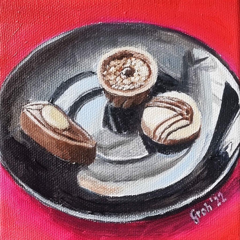 Pralinen auf schwarzem Teller